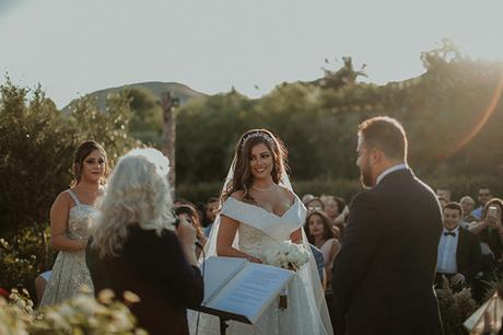 Rustic summer wedding in Nicosia with string lights and flowers in vivid colors | Joy & Pierre