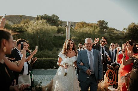 Rustic summer wedding in Nicosia with string lights and flowers in vivid colors | Joy & Pierre