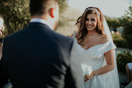 Rustic summer wedding in Nicosia with string lights and flowers in vivid colors | Joy & Pierre