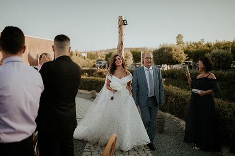 Rustic summer wedding in Nicosia with string lights and flowers in vivid colors | Joy & Pierre