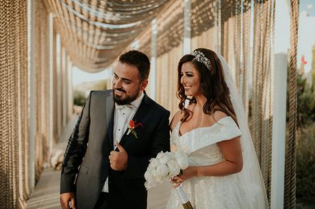 Rustic summer wedding in Nicosia with string lights and flowers in vivid colors | Joy & Pierre