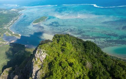 Aerial view to the top of the mountain of Le Morne Brabant and the blue lagoon, Mauritius