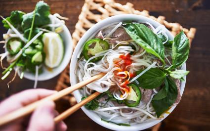 vietnamese pho with spicy sriracha sauce shot top down