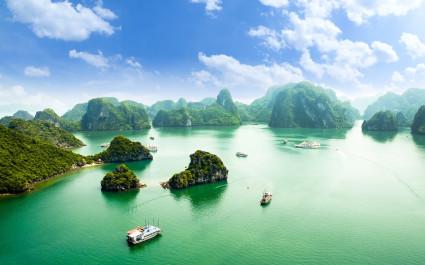 Enchanting Travels - Custom Vietnam Tours-HALONG bay in vietnam. UNESCO World Heritage Site. This view from TiTop island and its most popular view for travel in Halong bay.