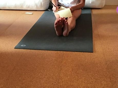 journaling on a yoga mat