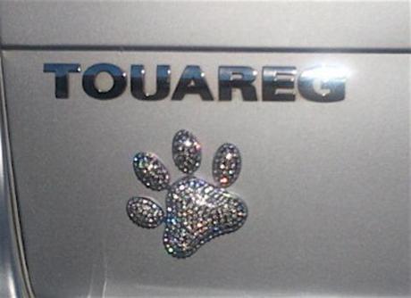 Dress up your drive in style with rhinestone dog paw emblem