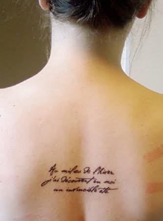 Rib Invincible Tattoo