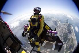 Jetman prepares to fall out of a Breitling helicopter to begin his flight.