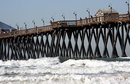 15 Incredible Images Of Waves Smashing Against Piers