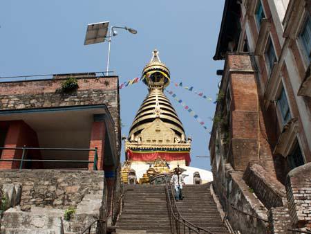 The gold gilding of the stupa seen from the lower stairs