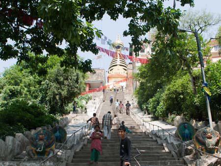 The stairs leading to the large stupa visible at the top