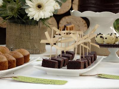 A Dessert Table with Beautiful Natural Earthy Tones and fantastic wooden log backdrop By That Cute Little Cake