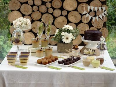 A Dessert Table with Beautiful Natural Earthy Tones and fantastic wooden log backdrop By That Cute Little Cake