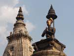 King Bhupatindra Malla column with the spire of the Vatsala Durga Temple in the background