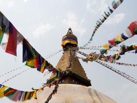 Prayer flags running to the tip of Bodhnath Stupa