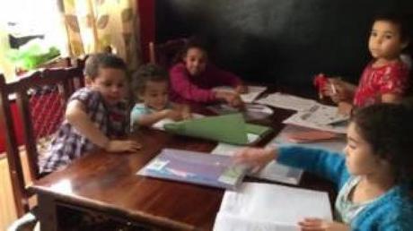 Digital divide: Six children sharing one phone for homework Digital divide: Six children sharing one phone for homework