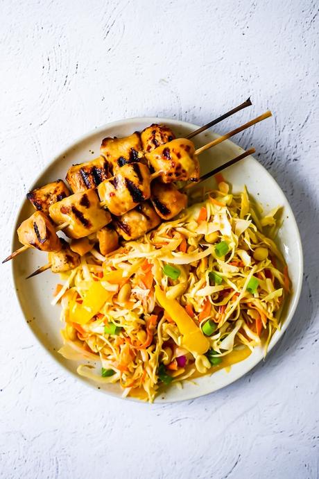 overhead view of chicken satay salad on a plate