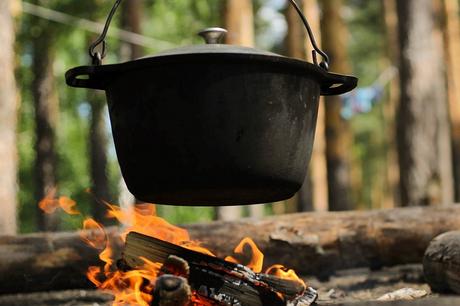 dutch oven hanging over a fire