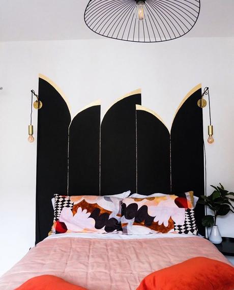 Unusual painted wall ideas - black and gold art deco style painted headboard