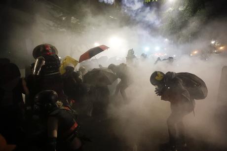 Clashes between police and protesters harden beyond Portland