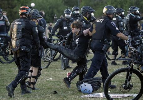 Clashes between police and protesters harden beyond Portland