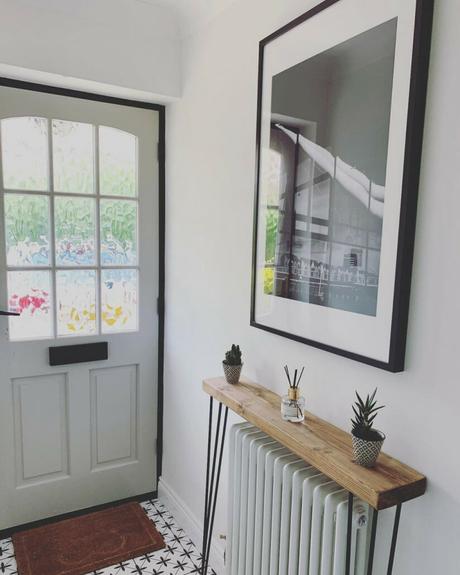 a white column radiator with a shelf above