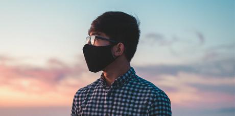 man with black face mask and glasses
