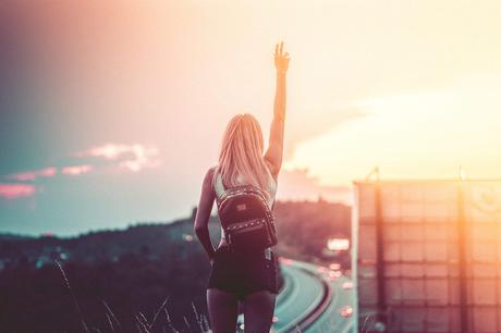 Young Woman Enjoying Freedom in the Summer Evening