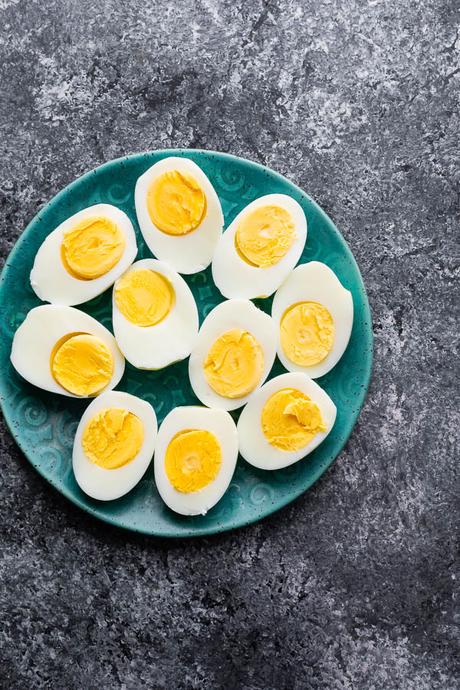 plate with 10 hard boiled egg halves on it