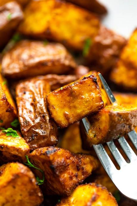 close up view of air fryer roasted potatoes on fork