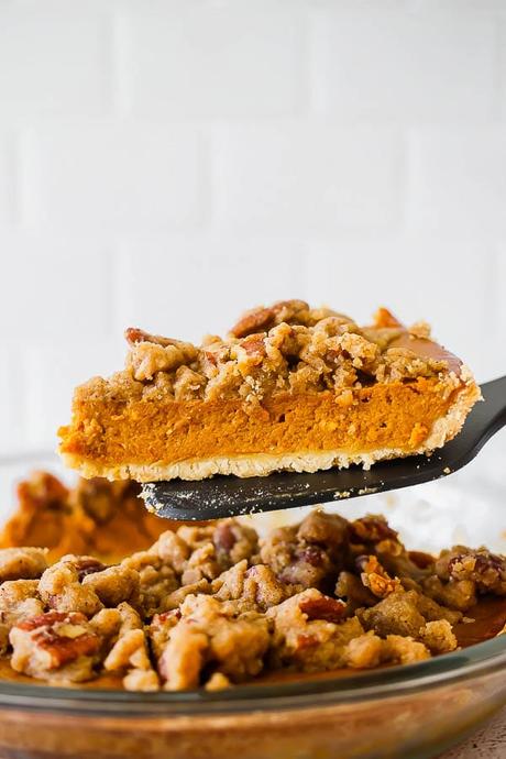 slice of pumpkin pie on a spatula