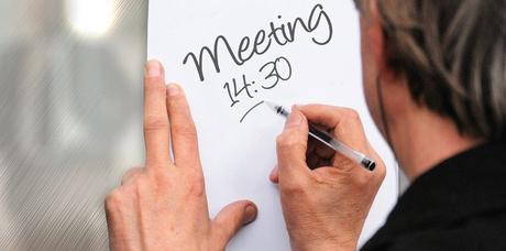 man writing a note for pomodoro technique