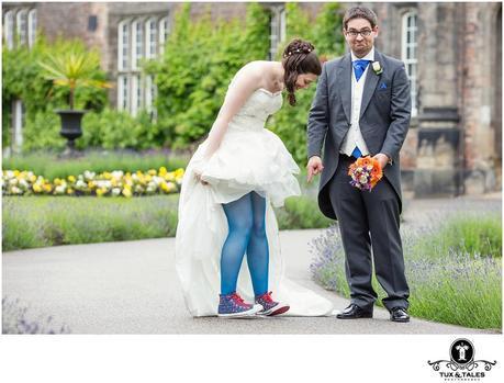 Quirky york wedding couple with blue rainbow converse boots