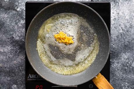 garlic added to butter in a pan