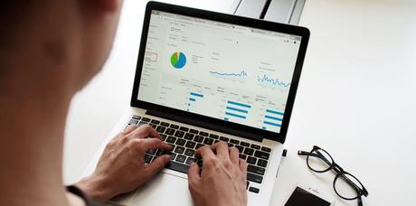 hands on laptop keyboard with open browser tabs