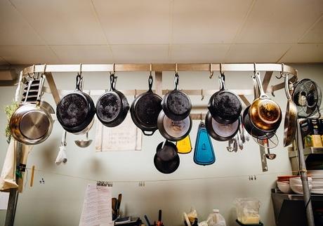 Pots and pans hanging from hooks