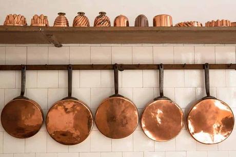 Hanging copper pans as decoration