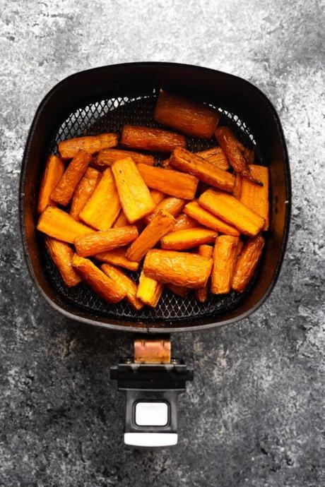 overhead view of carrots in air fryer basket