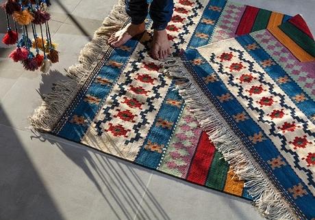 A person standing on a rug symbolizing ways to update your rented home without risking your deposit.