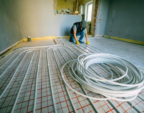 Plumber fitting underfloor heating