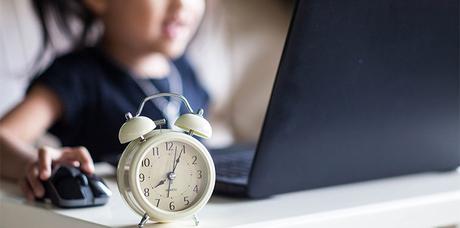 concept of time control-child playing game computer