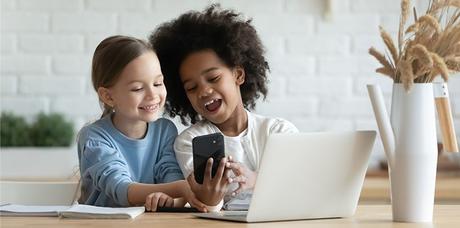 two girls spending too much time in front of screen