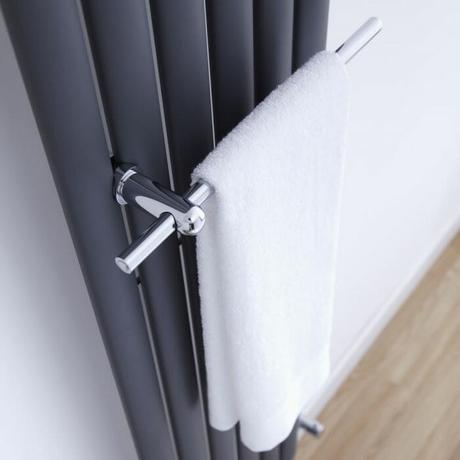 white towel hanging on a radiator