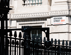 a street sign showing the name of Downing street in London