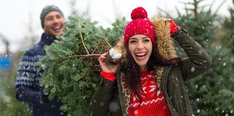 couple buying perfect christmas tree