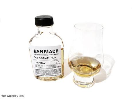 White background tasting shot with the BenRiach The Original Ten bottle and a glass of whiskey next to it.