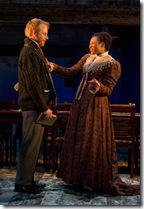 (right to left) Natasha (ensemble member Alana Arenas) speaks glowingly of her son with husband Andrey (Dan Waller) in Steppenwolf Theatre Company’s production of Anton Chekhov’s Three Sisters, adapted by ensemble member Tracy Letts, directed by ensemble member Anna D. Shapiro. 