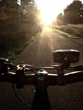 Looking over the handlebars towards the sinking sun.