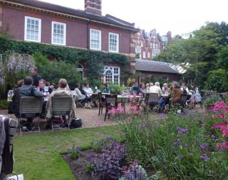 outdoor diners take advantage of some dry weather at the chelsea physic garden