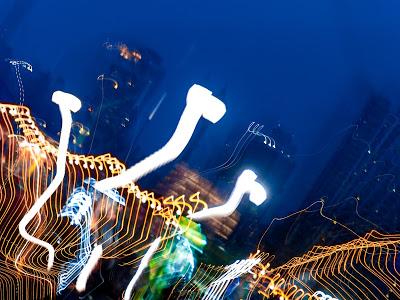 City lights on the sly, round and round [blue sky night]